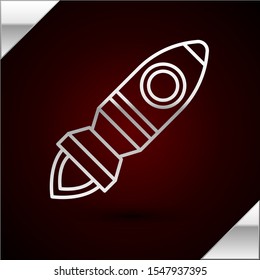 Silver line Rocket ship with fire icon isolated on dark red background. Space travel.  Vector Illustration