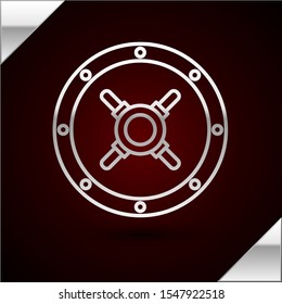 Silver line Safe icon isolated on dark red background. The door safe a bank vault with a combination lock. Reliable Data Protection.  Vector Illustration