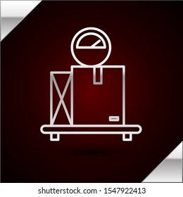 Silver line Scale with cardboard box icon isolated on dark red background. Logistic and delivery. Weight of delivery package on a scale.  Vector Illustration
