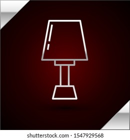 Silver line Table lamp icon isolated on dark red background.  Vector Illustration