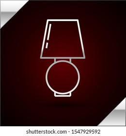 Silver line Table lamp icon isolated on dark red background.  Vector Illustration