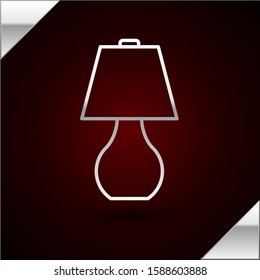 Silver line Table lamp icon isolated on dark red background.  Vector Illustration