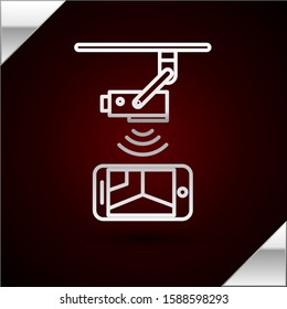 Silver line Wireless Controlling CCTV security camera with smartphone icon isolated on dark red background. IOT Concept and remote home appliance.  Vector Illustration