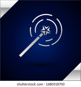 Silver Magic wand icon isolated on dark blue background. Star shape magic accessory. Magical power.  Vector Illustration