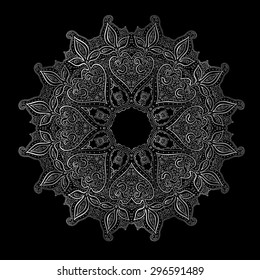 Silver mandala on black background. Indian pattern