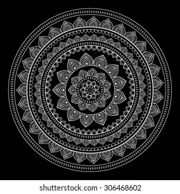 Silver mandala on black background. Indian pattern.