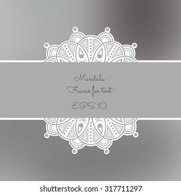 Silver mandala sticker frame for text on a gray blurred background