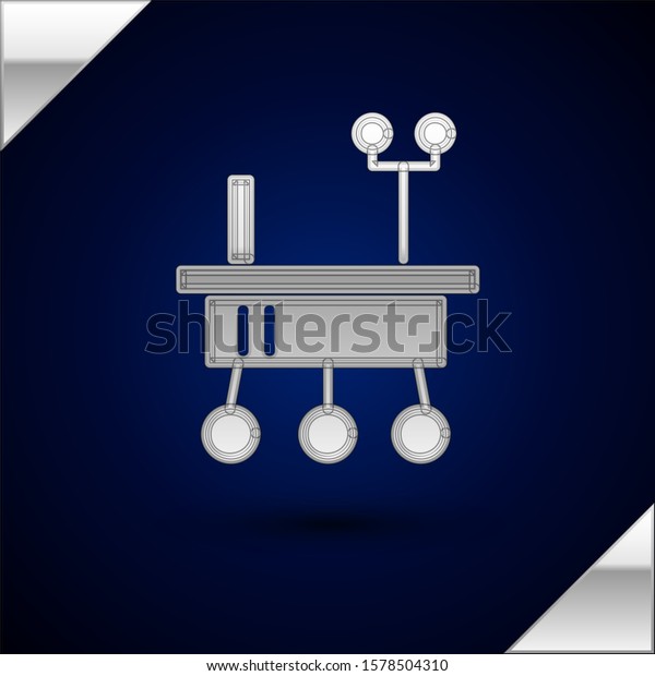 Silver Mars rover icon isolated on dark blue\
background. Space rover. Moonwalker sign. Apparatus for studying\
planets surface.  Vector\
Illustration