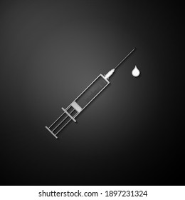 Silver Medical syringe with needle and drop icon isolated on black background. Syringe sign for vaccine, vaccination, injection, flu shot. Long shadow style. Vector.
