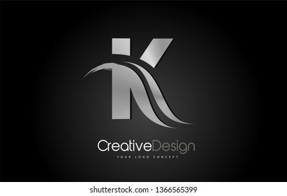 Silver Metal K Letter Design Brush Paint Stroke. Letter Logo on Black Background