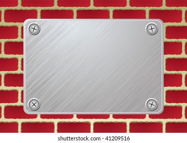 silver metal plate with screw on red brickwall