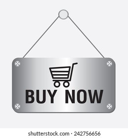 silver metallic buy now sign hanging on the wall 