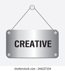 silver metallic creative sign hanging on the wall 