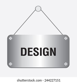 silver metallic design sign hanging on the wall 