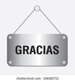 silver metallic gracias sign hanging on the wall