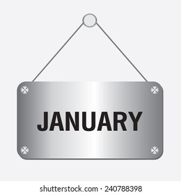 silver metallic january sign hanging on the wall 