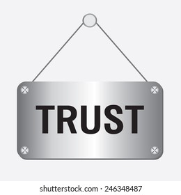 silver metallic trust sign hanging on the wall 