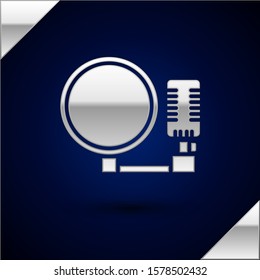 Silver Microphone icon isolated on dark blue background. On air radio mic microphone. Speaker sign.  Vector Illustration