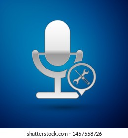 Silver Microphone with screwdriver and wrench icon isolated on blue background. Adjusting, service, setting, maintenance, repair, fixing.  Vector Illustration