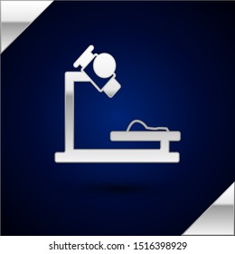Silver Microscope icon isolated on dark blue background. Chemistry, pharmaceutical instrument, microbiology magnifying tool.  Vector Illustration