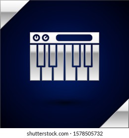 Silver Music synthesizer icon isolated on dark blue background. Electronic piano.  Vector Illustration