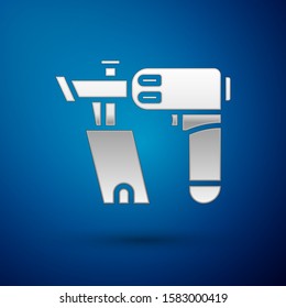Silver Nail gun icon isolated on blue background.  Vector Illustration