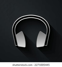 Silver Noise canceling headphones icon isolated on black background. Headphones for ear protection from noise. Long shadow style. Vector