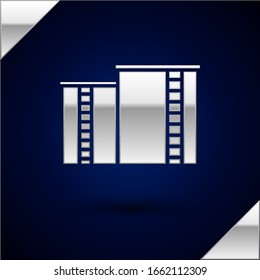 Silver Oil and gas industrial factory building icon isolated on dark blue background.  Vector Illustration