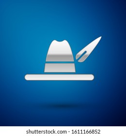 Silver Oktoberfest hat icon isolated on blue background. Hunter hat with feather. German hat.  Vector Illustration