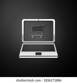 Silver Online shopping concept. Shopping cart on screen laptop icon isolated on black background. Concept e-commerce, online business marketing. Long shadow style. Vector.