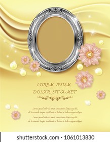 Silver Oval frame photo on Golden silk wave background, Flowers and pearls Lay on the sand