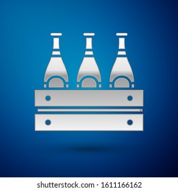 Silver Pack of beer bottles icon isolated on blue background. Wooden box and beer bottles. Case crate beer box sign.  Vector Illustration