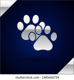 Silver Paw print icon isolated on dark blue background. Dog or cat paw print. Animal track.  Vector Illustration