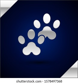 Silver Paw print icon isolated on dark blue background. Dog or cat paw print. Animal track.  Vector Illustration