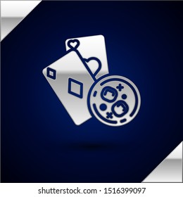 Silver Playing cards and glass of whiskey with ice cubes icon isolated on dark blue background. Casino gambling.  Vector Illustration