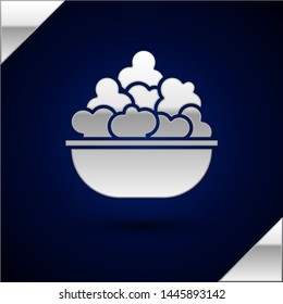 Silver Popcorn in bowl icon isolated on dark blue background. Popcorn bucket box.  Vector Illustration