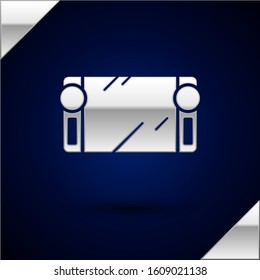 Silver Portable video game console icon isolated on dark blue background. Gamepad sign. Gaming concept.  Vector Illustration
