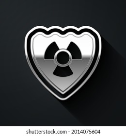 Silver Radioactive in shield icon isolated on black background. Radioactive toxic symbol. Radiation Hazard sign. Long shadow style. Vector