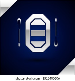 Silver Rafting boat icon isolated on dark blue background. Inflatable boat with paddles. Water sports, extreme sports, holiday, vacation.  Vector Illustration