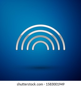 Silver Rainbow with clouds icon isolated on blue background.  Vector Illustration