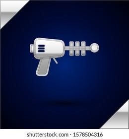 Silver Ray gun icon isolated on dark blue background. Laser weapon. Space blaster.  Vector Illustration