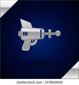 Silver Ray gun icon isolated on dark blue background. Laser weapon. Space blaster.  Vector Illustration