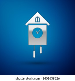 Silver Retro wall watch icon isolated on blue background. Cuckoo clock sign. Antique pendulum clock. Vector Illustration