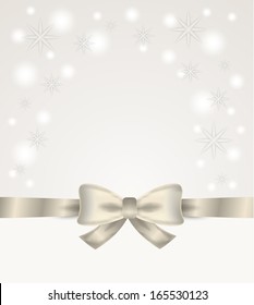 silver ribbon and bow with stars and snow flakes on silver background