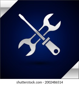 Silver Screwdriver and wrench spanner tools icon isolated on dark blue background. Service tool symbol.  Vector