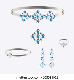 silver set from necklace ring earrings brooch and bracelets with dark blue stones on grey background
