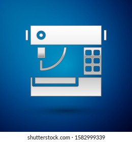 Silver Sewing machine icon isolated on blue background.  Vector Illustration
