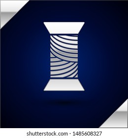 Silver Sewing thread on spool icon isolated on dark blue background. Yarn spool. Thread bobbin.  Vector Illustration