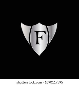 Silver Shield Logo Design for Letter F. Vector Realistic Metallic logo Template Design for Letter F. Silver Metallic Logo. Logo Design for car, safety companies and others.