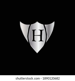 Silver Shield Logo Design for Letter H. Vector Realistic Metallic logo Template Design for Letter H. Silver Metallic Logo. Logo Design for car, safety companies and others.